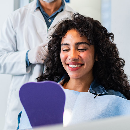 Young woman smiling after One Call recovery
